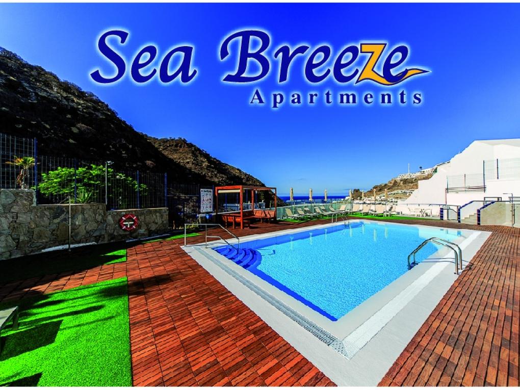 Zwembad : Appartement te huur in Sea Breeze,  Puerto Rico, Barranco Agua La Perra, Gran Canaria  met zeezicht : Ref 3669