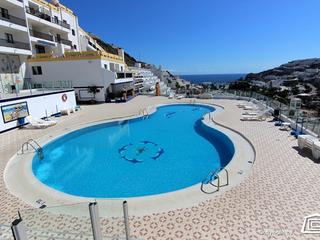 Appartement te huur in Puerto Feliz,  Puerto Rico, Gran Canaria  met zeezicht : Ref 3792
