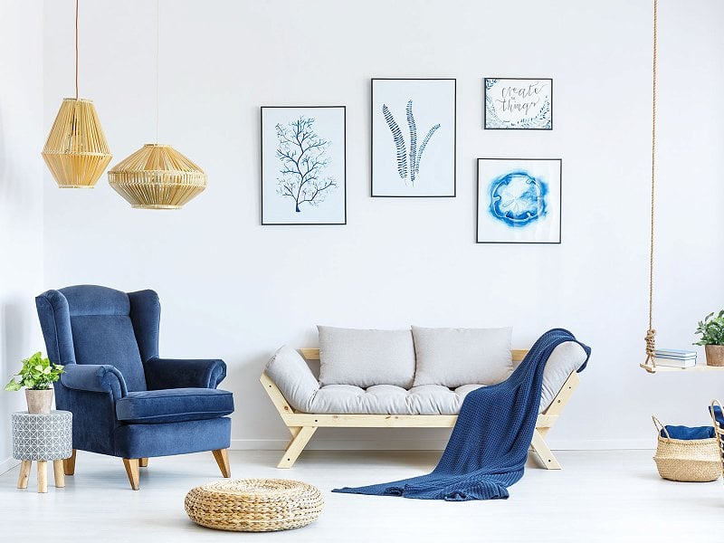 Living room with sofa and armchair decorated in nordic style